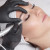 Cosmetologist making permanent makeup
